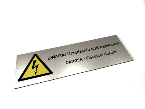 Tabliczka - urządzenie pod napięciem Tabliczka - urządzenie pod napięciem